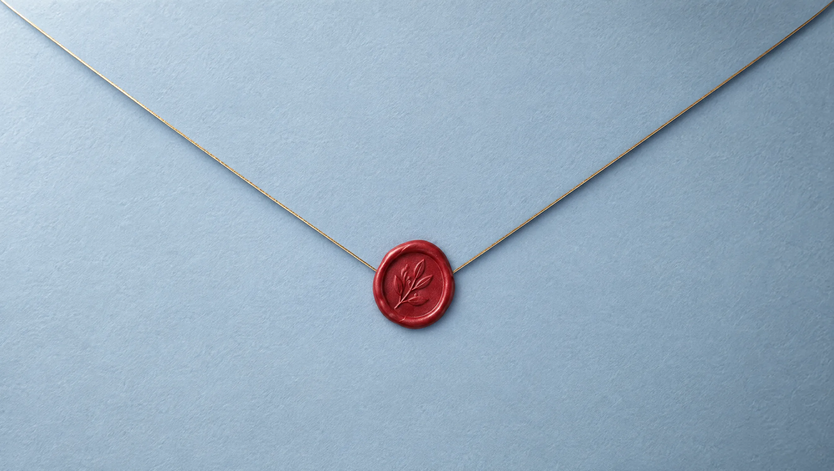 The back of a powder-blue envelope with a fine gold line along its flap, sealed with cherry-red wax